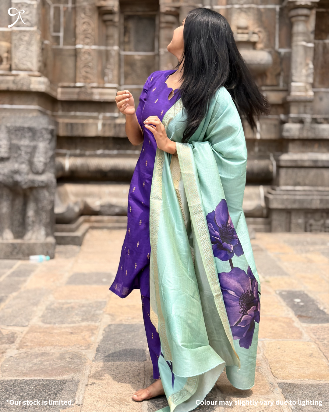 Side view of violet salwar set with pastel floral dupatta