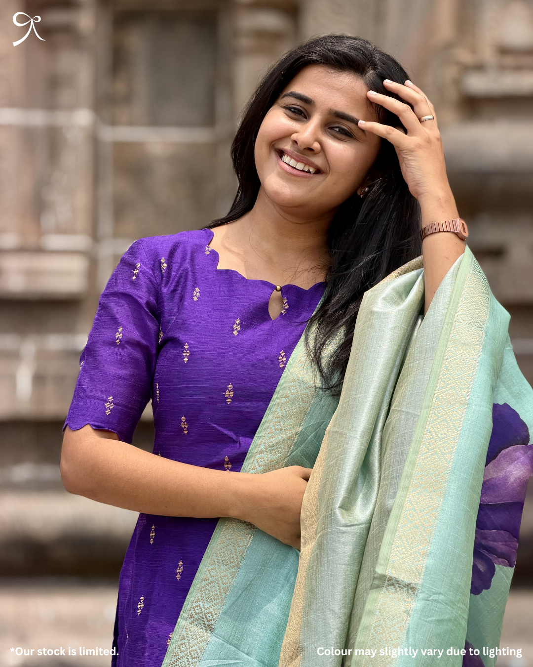 Smiling model wearing violet ethnic set with mint muslin shimmer dupatta